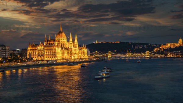 View of hungarian Parliament and Chain Bridge on river Danubeat night