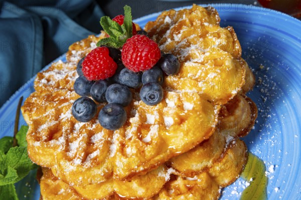 Simple sweet waffles with raspberries and blueberries