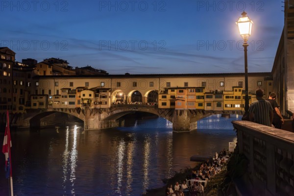Famous Ponte Vecchio in Florence illuminated at night, Italy, Europe