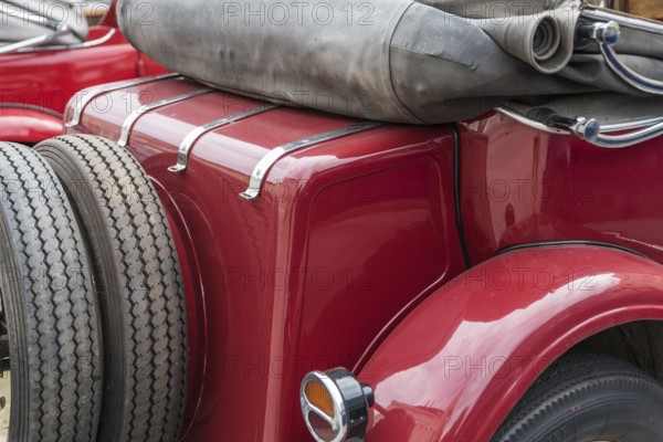 Convertible from behind with spare tyre - close-up of saloon