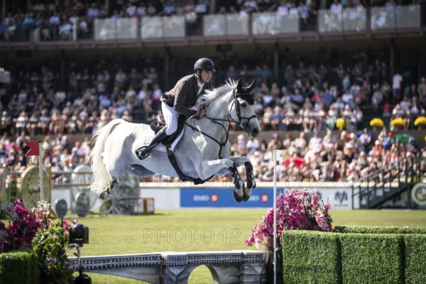 Donald Whitaker of Great Britain and riding Millfield Colette compete in the first round of the 1.60m CPKC International during the Spruce Meadows Masters, presented by Rolex, in Calgary, Alberta, Canada, North America