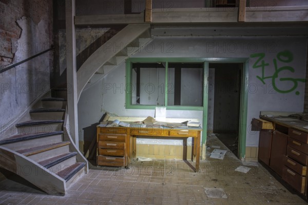 Old abandoned paper factory. Historic and typical factory building as a lost place. Destruction and decay are damaging the substance. Original machines and objects can be found here in Sweden