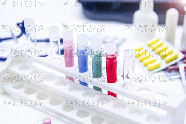 Colorful test tubes and medicine on a bright laboratory table