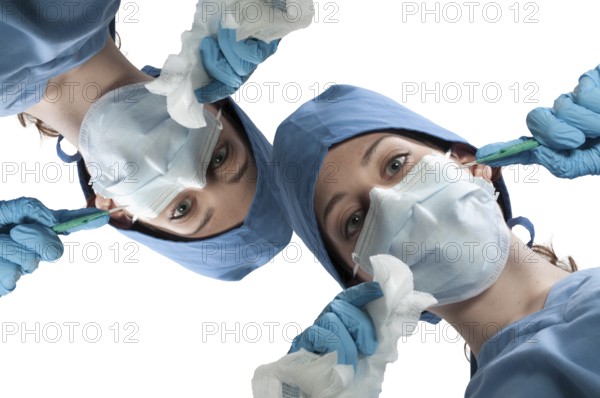 A beautiful young woman surgeon performing surgery
