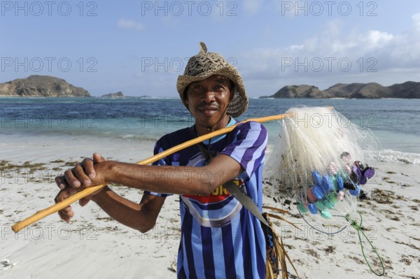 09.09.2011, Lombok, West Nusa Tenggara, Indonesia, Asia, A local fisherman on the beach of Tanjung Aan near the small village of Kuta in the south of the island, Asia
