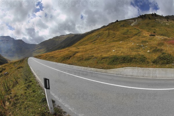 The magnificent mountain valley. Winding and dangerous road - the Serpentine. Photo taken by lens Fisheye