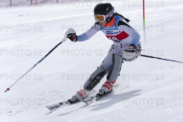 Mount skier Naumova Alexandra Murmansk Region skiing down mount slope. International Ski Federation Championship, Russian Alpine Skiing Cup, slalom. Moroznaya Mount, Kamchatka, Russia, March 29, 2019, Europe