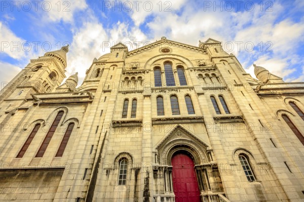 Left side facade and door of Basilique Sacred Heart in Montmartre of Paris in France with no people. Popular religious attraction in Paris city of France, Europe, Paris, Francia