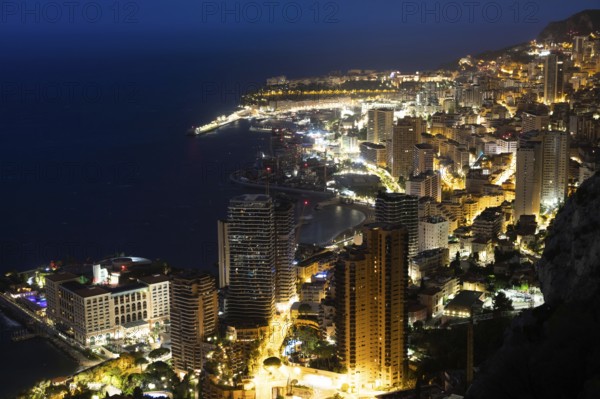 Monte Carlo panorama illuminated by night. Urban landscape with luxury architecture