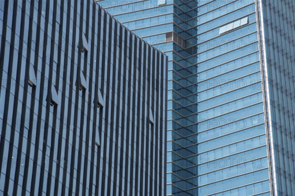 Modern glass skyscraper office building with open windows