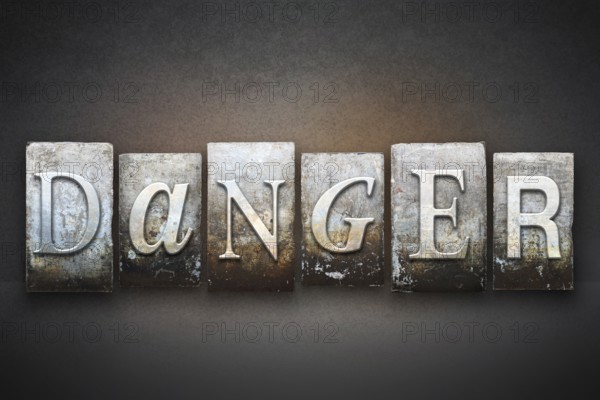The word DANGER written in vintage letterpress type