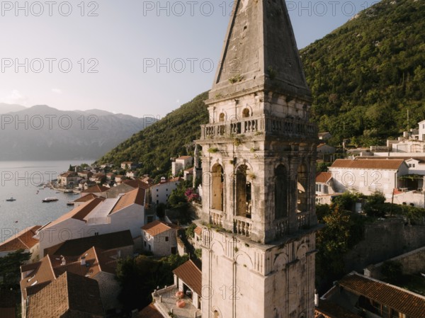 Bell tower of the Church of St. Nicholas in Perast. Montenegro. Drone.