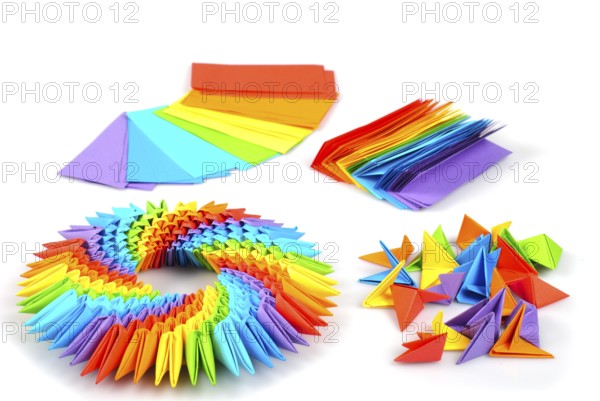 Colorfull origami 3d units like a rainbow circle isolated on white with shadow. From sheets of paper making modules, which joined