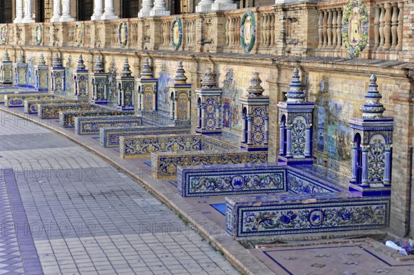 Plaza de España in Seville, Seville, Andalusia, Spain, Europe, Several artistic benches with colourful tiles along a wall, Europe