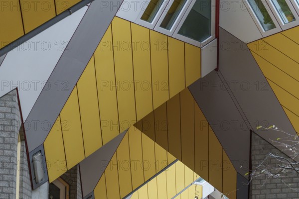 Section of a modern building with yellow panels and geometric shapes, rotterdam, the netherlands