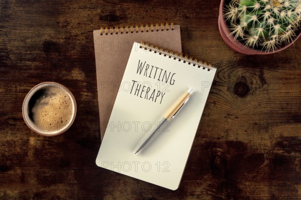 Writing Therapy. Notebook with a pen, coffee, and a plant, overhead flat lay shot on a rustic wooden desk, Food photography, Food photography