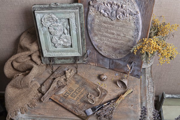 Still life with handmade artworks on a wooden studio background