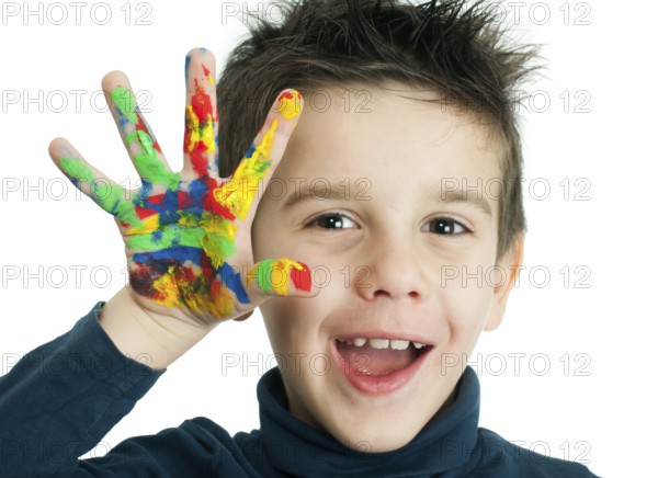Boy hands painted with colorful paint. White islated smiling child