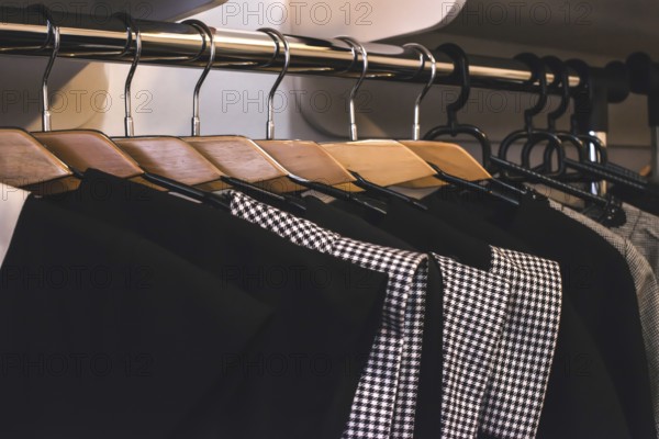 Clothes on hangers in shop. Close up