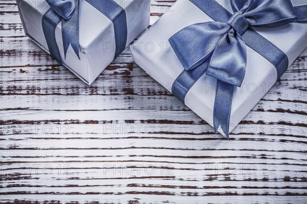 Packed giftboxes on vintage wood board holidays concept