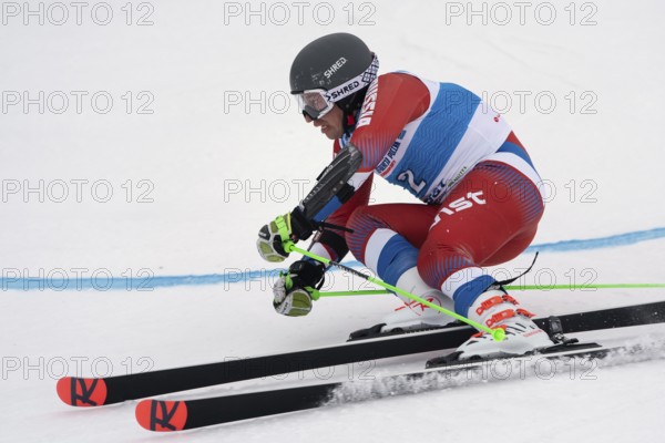 KAMCHATKA, RUSSIAN FEDERATION, APRIL 2, 2019: Russian Men's Alpine Skiing Championship, giant slalom. Mountain skier Alexandr Andrienko Kaluga Region skiing down snowy mountain slope