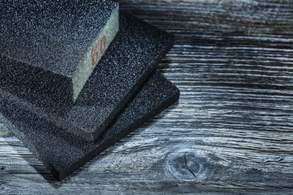 Polishing abrasive blocks on vintage wooden board