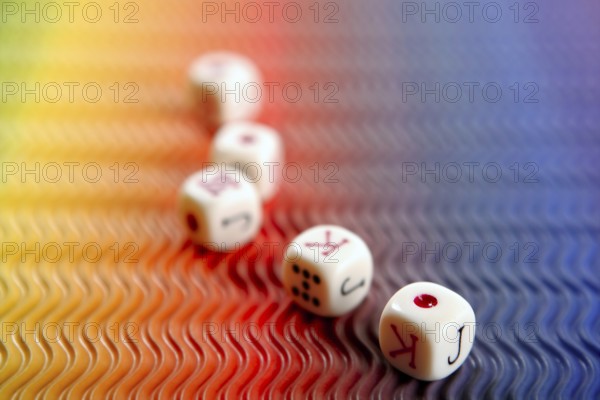 Poker dices over colored background, selective focus