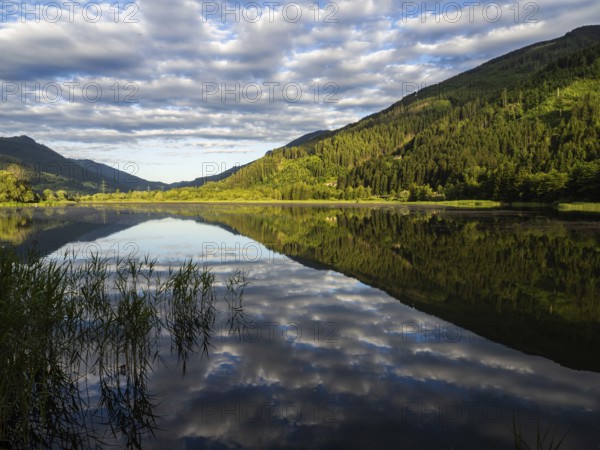 Clouds are reflected in the lake, Gaishorner See in the evening light, Gaishorn am See, Paltental, Styria, Austria, Europe