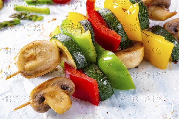 Vegetarian skewers white mushrooms, peppers and zucchini for barbecue