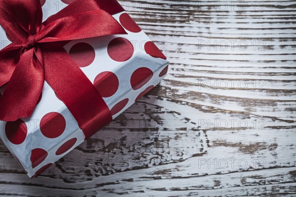 Present box on vintage wooden board celebrations concept