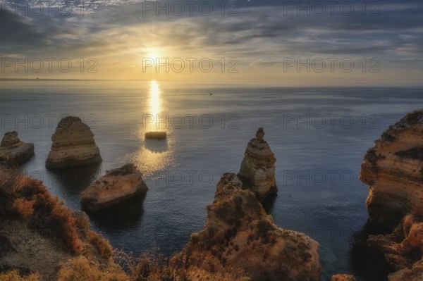 Lagos Praia da Balanca, Portuguese coast near the city of Lagos in the light of the rising sun
