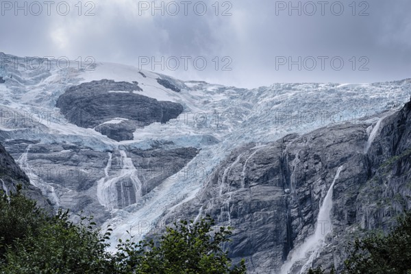 The Kjenndalsbreen is part of the Jostedalsbreen, one of the largest glaciers in Norway, and forms an impressive mountain landscape. The glacier Kjenndalsbreen in Norway is a beautiful place to travel to in summertime