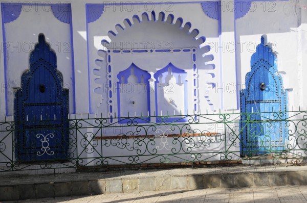 Chefchaouen, Rif Mountains, Morocco, Detail of blue ornamental doors with shadows on a white wall, Chefchaouen, Morocco, Africa