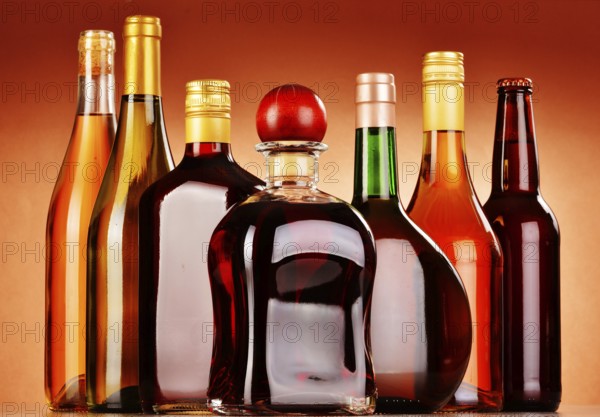 Bottles of assorted alcoholic beverages including beer and wine
