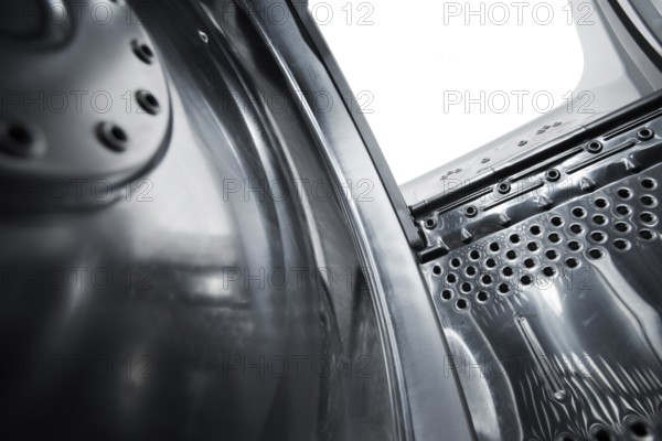 Interior view of a new european top loading washing machine. Very short depth-of-field