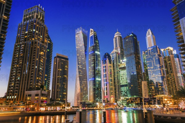 DUBAI, UNITED ARAB EMIRATES - FEB 5, 2019: Modern residential architecture of Dubai Marina, United Arab Emirates. City skyline by night