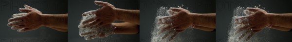 Hands of Man with Flour against black background