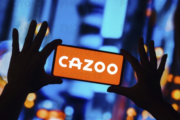 In this photo illustration, the Cazoo logo is displayed on a smartphone screen