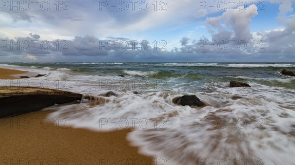 A dramatic sunset looking over the Pacific Ocean. Kauai, Hawaii