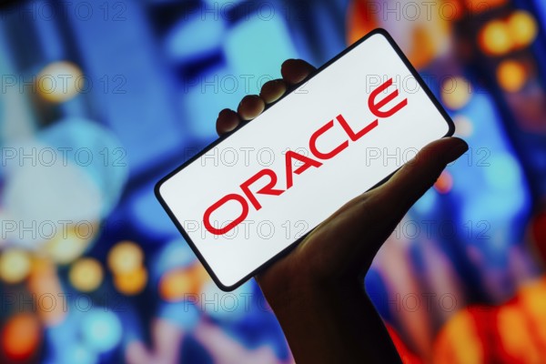 In this photo illustration, the Oracle logo is displayed on a smartphone screen