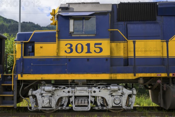 Close-up of a blue and yellow locomotive of the Alaska Railway with the number 3015, Alaska Railroad, Seward, Alaska, USA, North America