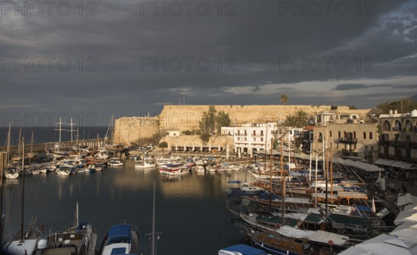 Harbour with luxury travel yachts and boats at sunset at Kerynia city harbor in Cyprus
