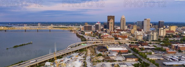 Colorful bridges lead into the buildings and streets of downtown city center Louisville Kentucky