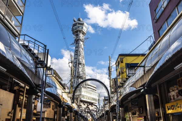 OSAKA, JAPAN - SEPTEMBER 26 2024: The famous Shinsekai area with Tsutenkaku Tower on a clear autumn day in Osaka, Japan, Asia
