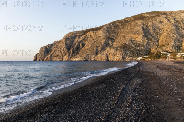 Morning atmosphere, rocky cape Mesa Vouno, lava beach Kamari Beach, Santorini, Cyclades, Greece, Europe