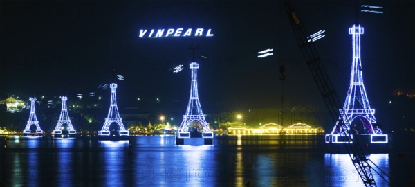 NHA TRANG, VIETNAM - JANUARY 4, 2016: A night view at illuminated supports of cableway to Vinpearl, a large amusement park located on an island, the main place of interest in the city which is a popular sea resort