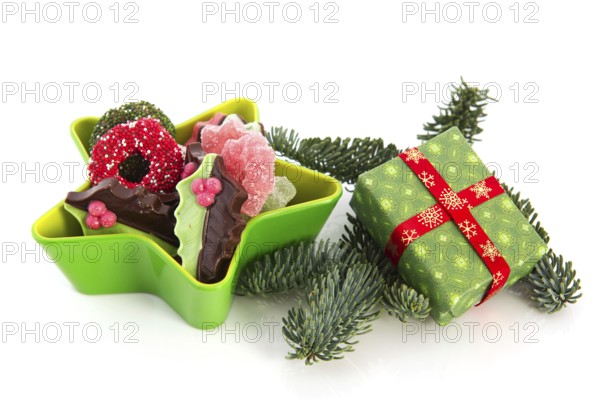 Green star full with christmas chocolate and present