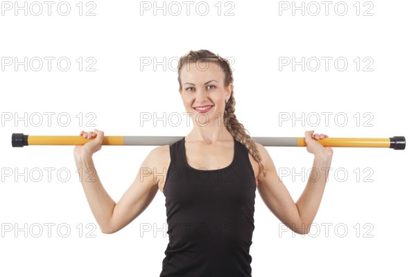 Athletic young woman with pole isolated on white