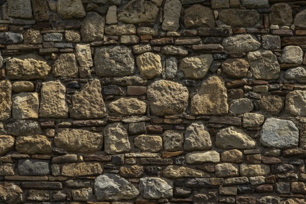 Old medieval stone and brick wall background
