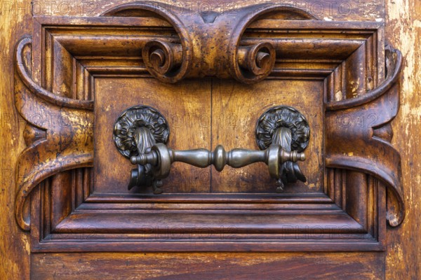 Close up of rustic old door in Florence, Italy, Europe
